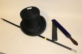 A VINTAGE TOP HAT BY G. H. HARROP OF STOKE ON TRENT, TOGETHER WITH AN EBONISED WALKING CANE AND A '