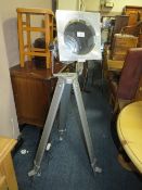 A MODERN INDUSTRIAL STYLE TRIPOD FLOORSTANDING LAMP