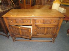 A REPRODUCTION CARVED OAK SIDEBOARD, H 92 CM, W 138 CM