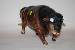 A LARGE SYLVAC FIGURE OF A BULL, OVERALL LENGTH 38 CM