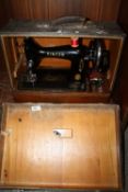A CASED VINTAGE SINGER SEWING MACHINE