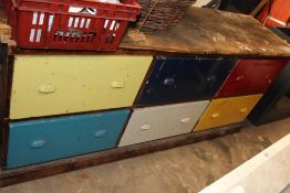 A LARGE WORKSHOP CHEST OF DRAWERS