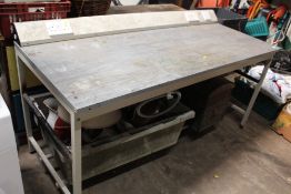 A LARGE WORKSHOP TABLE WITH PLUG ATTACHMENTS