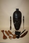 A LARGE AFRICAN STYLE MASK, INDONESIAN WOODEN BAG, CARVED SPOONS AND FORKS ETC