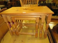 A SOLID PINE NEST OF TABLES H-51 W-74 CM LARGEST