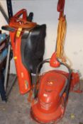 A FLYMO LAWNMOWER TOGETHER WITH A GARDEN VAC - HOUSE CLEARANCE