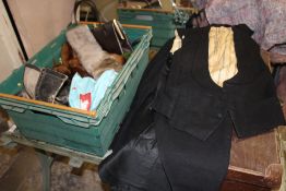 A SUITCASE AND A BOX OF VINTAGE CLOTHING TO INCLUDE VINTAGE ICE SKATES, UNION JACK FLAG ETC.
