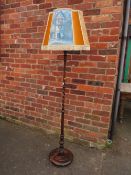 AN UNUSUAL 1920;S /30'S SLENDER OAK TAPERING BARLEYTWIST STAND LAMP AND SHADE