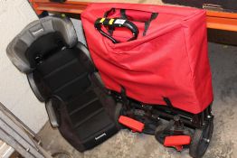 A FOLDOUT FESTIVAL STYLE TROLLEY TOGETHER WITH A CHILDS CAR SEAT