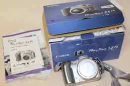 A BOXED CANON POWERSHOT S2IS DIGITAL CAMERA