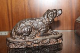 A VINTAGE METAL DOOR STOP IN THE SHAPE OF A SPRINGER SPANIEL