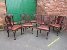 A SET OF EIGHT MAHOGANY 20TH CENTURY DINING CHAIRS RAISED ON CABRIOLE SUPPORTS WITH BALL AND CLAW
