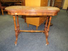 A MID VICTORIAN WALNUT, SHAPED FOLD OVER CARD TABLE H-74 W-95 CM IN POOR CONDITION