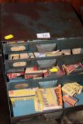 A METAL FOUR DRAWER TABLE TOP CHEST CONTAINING VINTAGE BOXED CAR LIGHT BULBS