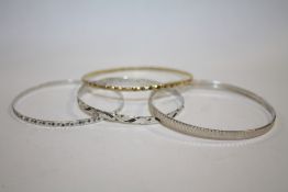 FOUR SILVER LADIES BANGLES - APPROX 27G