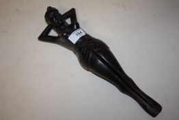 A NOVELTY TREEN NUTCRACKER IN THE FORM OF A FEMALE WITH OPENING LEG, H 33 cm