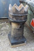 A CROWN TOPPED CHIMNEY TOPPER