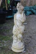 A SMALL FEMALE GARDEN STATUE