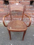 A CHILDS BENTWOOD ARMCHAIR BY 'J+J KOHN' PAPER LABEL TO THE UNDERSIDE OF THE SEAT - LOOSE FRONT LEG