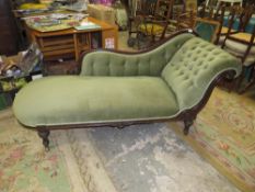 A VICTORIAN MAHOGANY UPHOLSTERED SHAPED CHAISE LONGUE