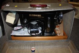 A CASED VINTAGE RUSHMORE SEWING MACHINE