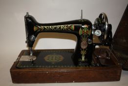 A VINTAGE OAK CASED SINGER SEWING MACHINE