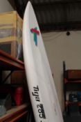 A TIGA 285 LWR WINDSURFING BOARD A/F TOGETHER WITH A WET SUIT ETC