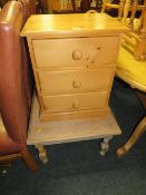 A SMALL STRIPPED OCCASIONAL TABLE AND A PINE THREE DRAWER BEDSIDE CHEST (2)