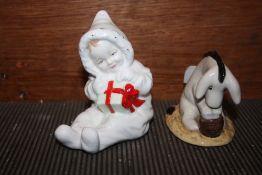 A ROYAL DOULTON WINNIE THE POOH COLLECTION 'EEYORE'S BIRTHDAY' FIGURE TOGETHER WITH A ROYAL