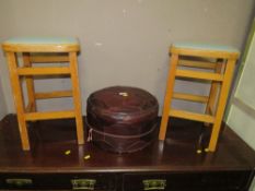 A VINTAGE RED POUFFE AND TWO UTILITY TYPE STOOLS (3)