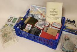 A SMALL TRAY OF COLLECTABLES TO INCLUDE A BOXED TOY CAR, VINTAGE DOLL, CIGARETTE CARDS ETC.