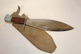 A BOWIE STYLE KNIFE IN MILITARY CANVAS SHEATH OVERALL LENGTH - 40.5CM