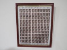 A SHEET OF 100 WW2 DEUTCHES REICH STAMPS SHOWING THE PROFILE OF ADOLF HITLER,SET IN A RED GLAZED