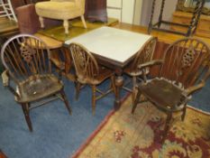 A VINTAGE OAK DRAWLEAF TABLE WITH FORMICA TOP AND FOUR WHEELBACK CHARS