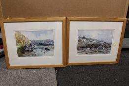 A PAIR OF PINE FRAMED AND GLAZED WATERCOLOURS DEPICTING HARBOUR SCENES WITH MOORED BOATS BY RAY