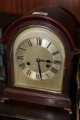 A VINTAGE MAHOGANY DOME TOPPED MANTEL CLOCK