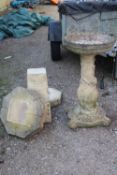 A STONE BIRDBATH WITH BIRD AND LEAF DETAIL ETC A/F