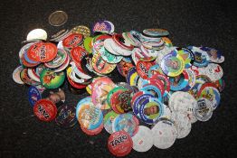 A COLLECTION OF POGS AND TAZOS