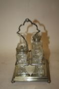 A SILVER PLATED FOUR BOTTLE CRUET SET, A/F