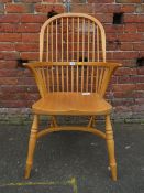A MODERN PINE WINDSOR HOOPBACK ARMCHAIR