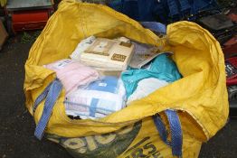 A LARGE BAG OF MOSTLY PACKAGED LINEN ETC. TO INCLUDE LADIES CLOTHING AND CURTAINS