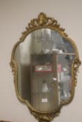 A GILT FRAMED MIRROR, APPROX. 78 X 66 CM