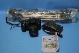 A CANON EOS 5000 CAMERA TOGETHER WITH ANOTHER AND A CAMERA TRIPOD (3)