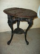 AN ANTIQUE CAST IRON PUB TABLE IN BRTANNIA TYPE