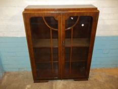 AN ANTIQUE BOOKCASE