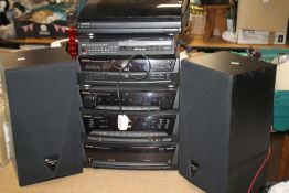 A KENWOOD STACKING SYSTEM WITH SPEAKERS, INSTRUCTIONS AND REMOTE