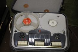 A VINTAGE REEL TO REEL TAPE RECORDER