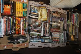 FOUR BOXES OF DVDS AND VIDEOS