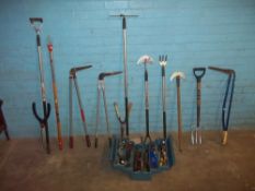 A SELECTION OF GARDEN TOOLS AND A TOOL BOX WITH TOOLS