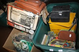 A TRINZ MAGNON PROJECTOR TOGETHER WITH A QUANTITY OF 8 MM REELS TO INCLUDE THE FLINTSTONES, 